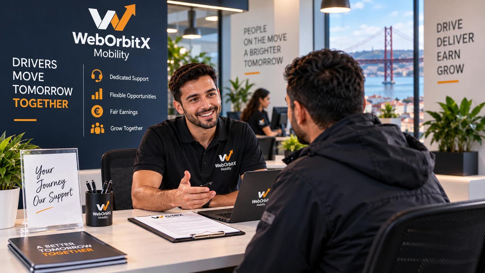 A WebOrbitX Mobility adviser going through paperwork with a driver at the office